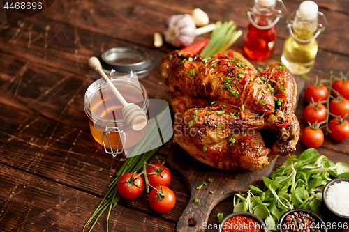 Image of Roasted whole chicken or turkey served with chilli pepers and chive