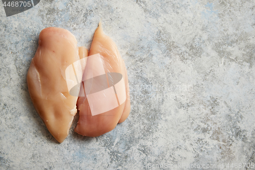 Image of Top view of two fresh raw chicken fillets