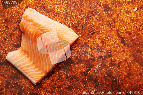 Image of Raw fresh salmon meat placed on rusty metal background