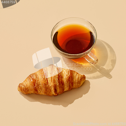 Image of cup of tea with long shadow