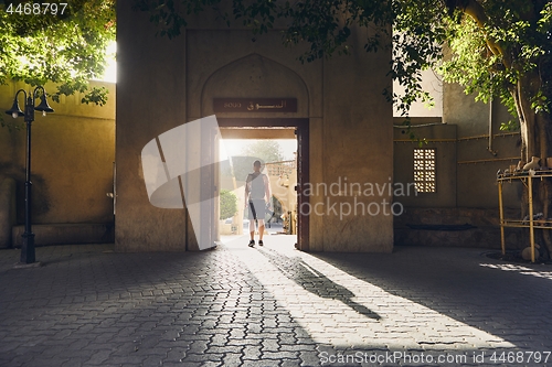 Image of Silhouette of young tourist