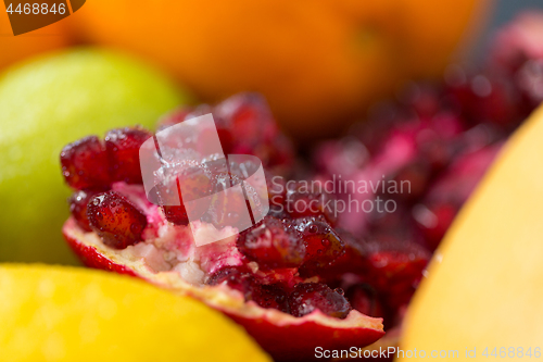 Image of close up of pomegranate on stone table