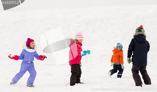 Image of happy little kids playing outdoors in winter