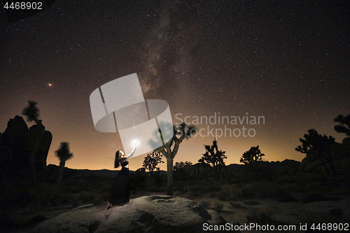 Image of Girl Light Painted Under the Milky Way