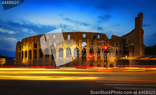 Image of Colosseum and car lights