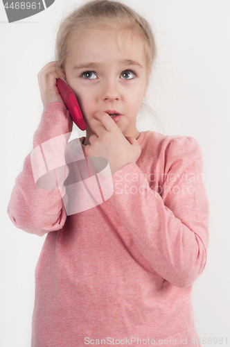 Image of Little girl talking on cellphone