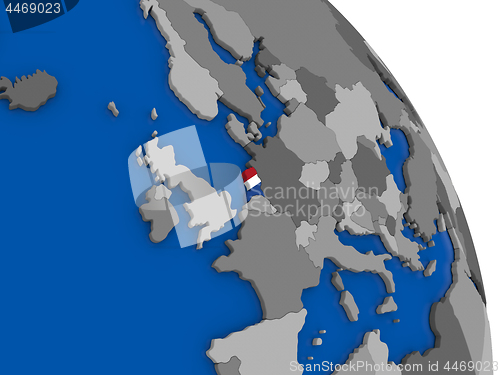 Image of Netherlands and its flag on globe