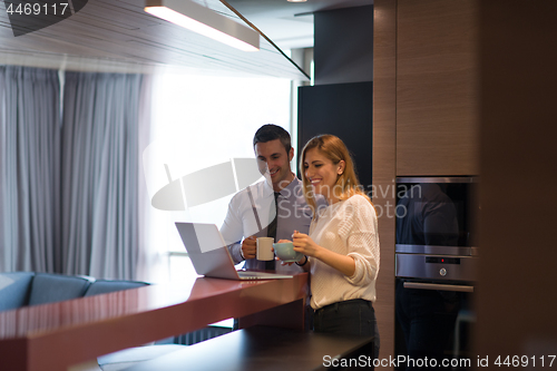 Image of A young couple is preparing for a job and using a laptop