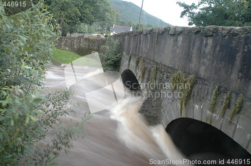 Image of flood under old bridge