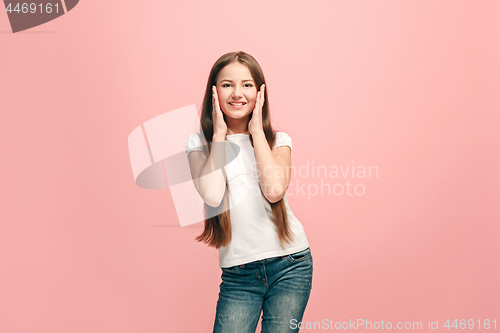 Image of Beautiful teen girl looking suprised isolated on pink
