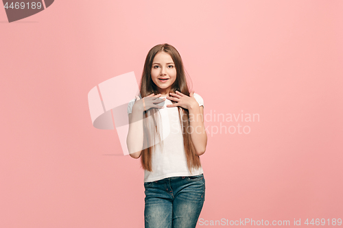 Image of Beautiful teen girl looking suprised isolated on pink