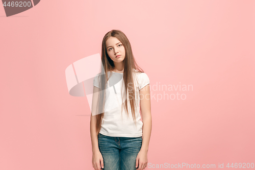 Image of Young serious thoughtful teen girl. Doubt concept.