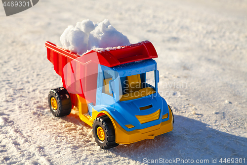 Image of toy truck removes snow on highway