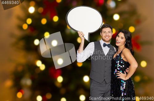 Image of happy couple at party holding text bubble banner