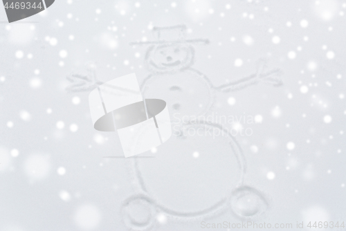 Image of snowman drawing on snow surface