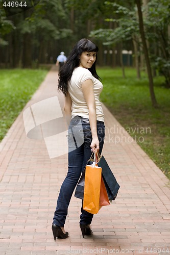 Image of brunet girl with shopping bags