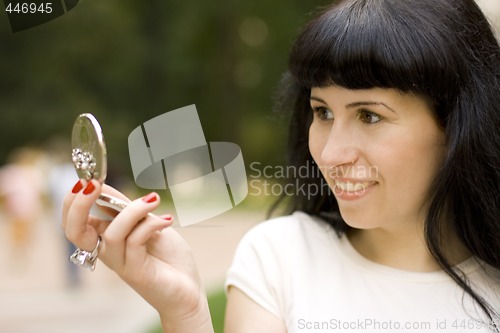 Image of girl looking in the mirror