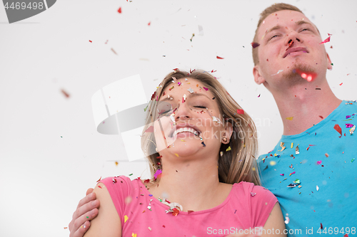 Image of romantic young  couple celebrating  party with confetti