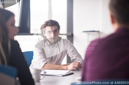 Image of Group of young people meeting in startup office