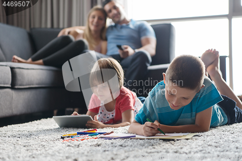 Image of young couple spending time with kids