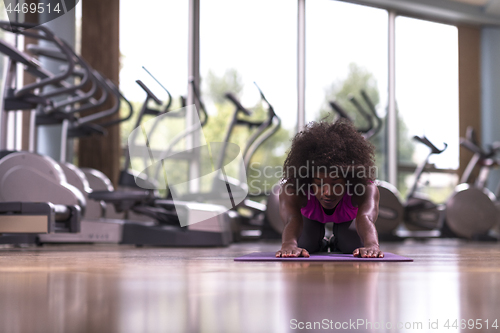 Image of african american woman exercise yoga in gym