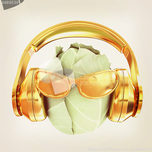 Image of Green cabbage with sun glass and headphones front \"face\" on a wh