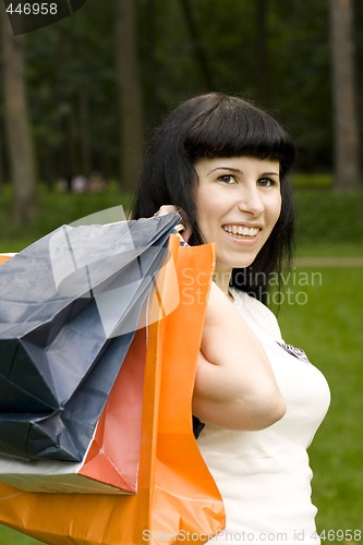 Image of  girl holding in hands bags