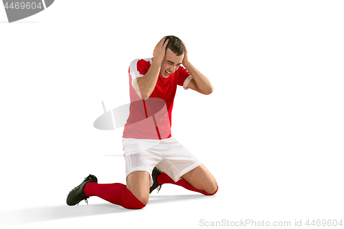 Image of unhappy soccer or football player with palm on his face