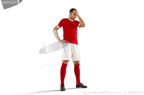 Image of unhappy soccer or football player with palm on his face