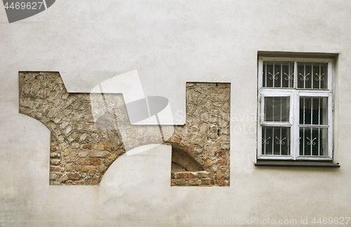 Image of Plastered wall with remains of old stonework