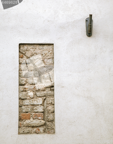 Image of Plastered wall with remains of old stonework