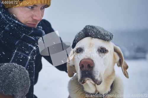 Image of Friendship between pet owner and his dog