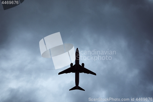 Image of Silhouette of airplane in storm