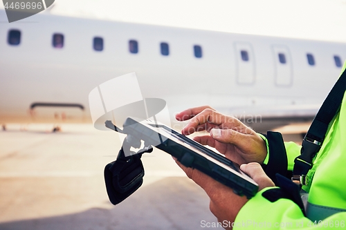 Image of Preparations of passenger airplane at the airport