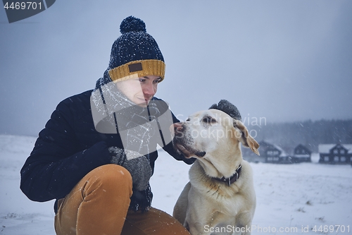 Image of Friendship between pet owner and his dog