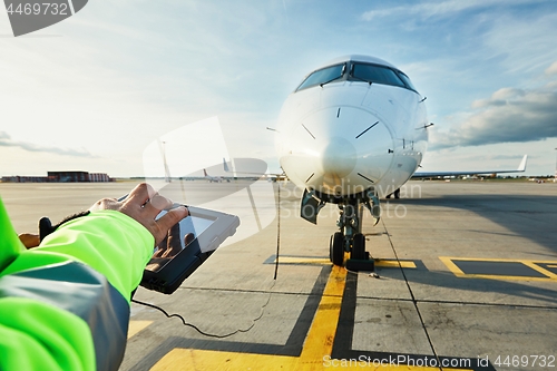 Image of Preparations of passenger airplane at the airport