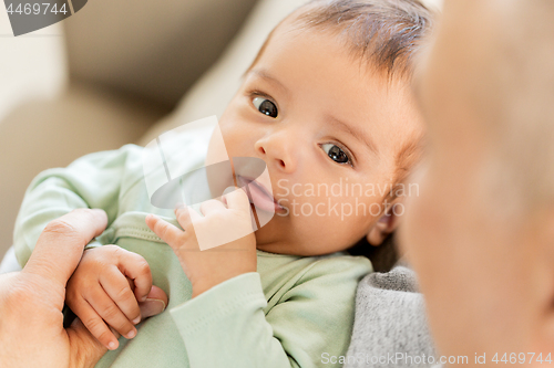 Image of close up of sweet little baby boy with parent