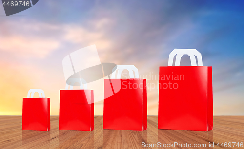 Image of red different size shopping bags