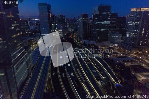 Image of view of night railway station in tokyo city, japan