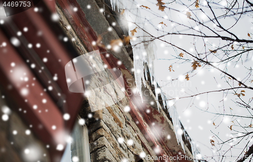 Image of icicles hanging from building roof