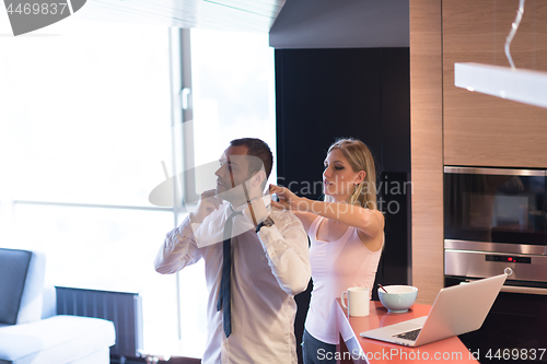 Image of A young couple is preparing for a job and using a laptop