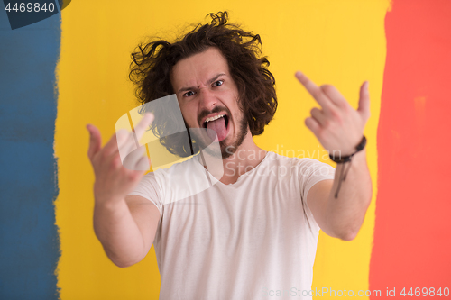 Image of young man with funny hair over color background