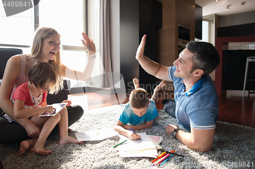 Image of young couple spending time with kids