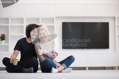 Image of young couple in their new home