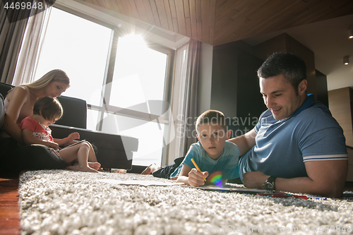 Image of young couple spending time with kids