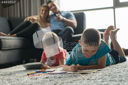 Image of young couple spending time with kids