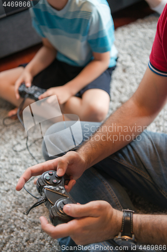 Image of Happy family playing a video game