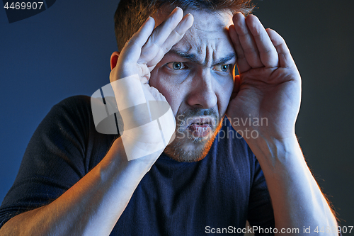 Image of Sports, emotions and fan people concept - sad man watching sports on tv and supporting team at home