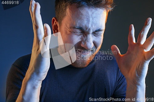 Image of Sports, emotions and fan people concept - sad man watching sports on tv and supporting team at home