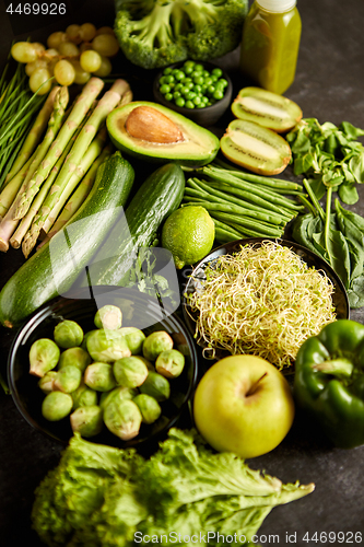 Image of Green healthy food composition with avocado, broccoli, apple, smoothie...